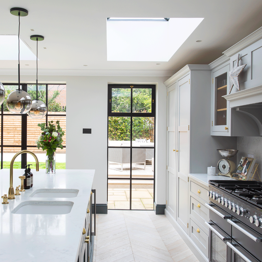 White open plan kitchen with a white island