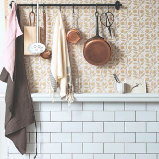 Wallpapered kitchen with a tiled panel