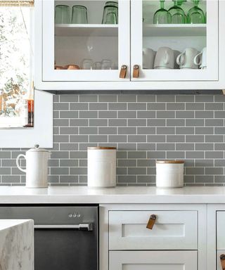 grey kitchen with peel and stick subway tiles
