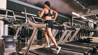 Fit women running on a treadmill in a gym