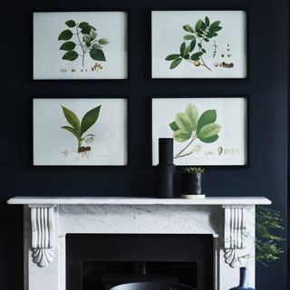botanical wall art in a navy living room
