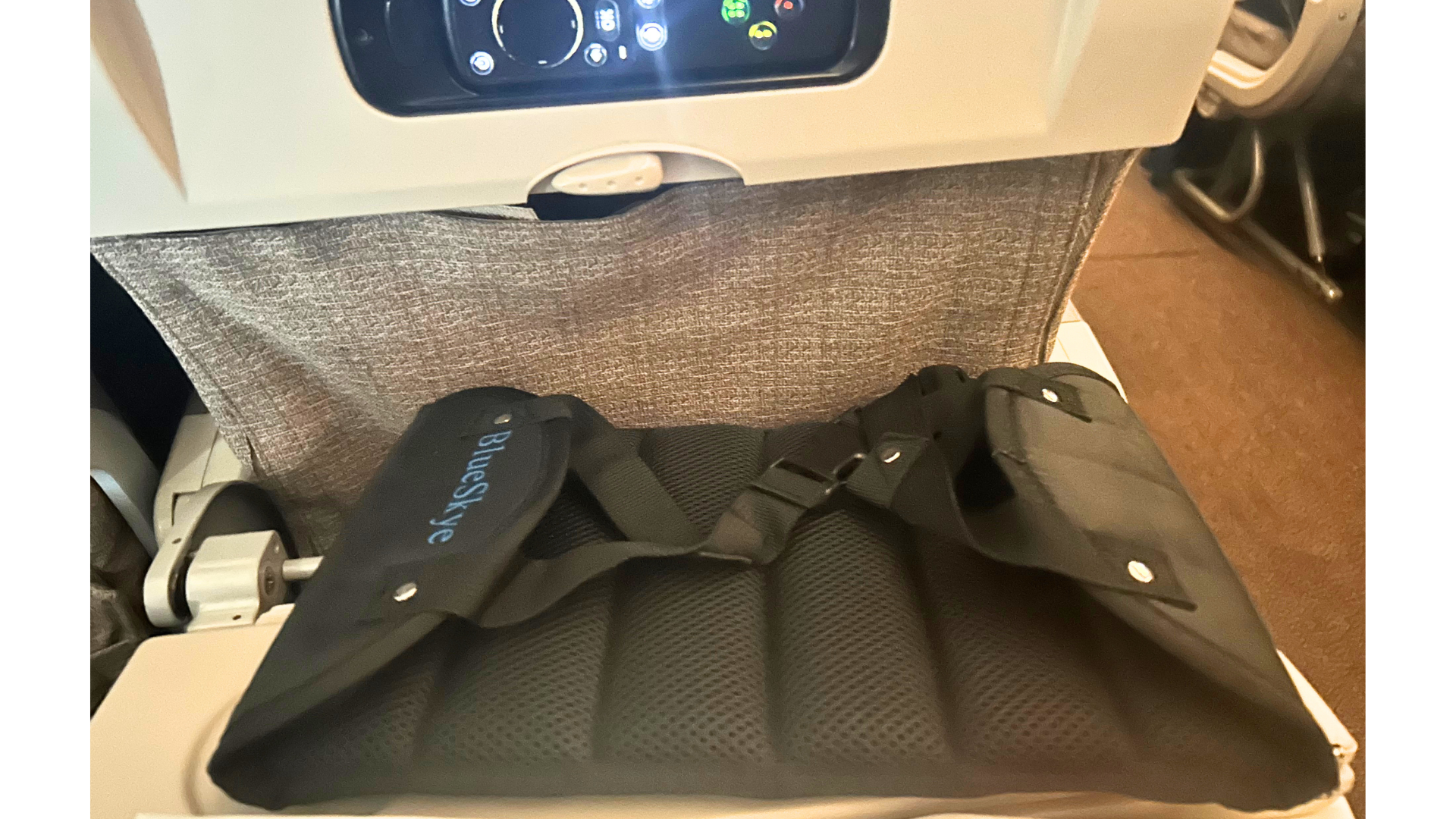 Jenny Haward's BlueSkye foot rest/foot hammock on an airplane tray table.