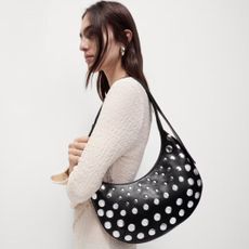 woman wearing a studded shoulder bag from the M&S new in section