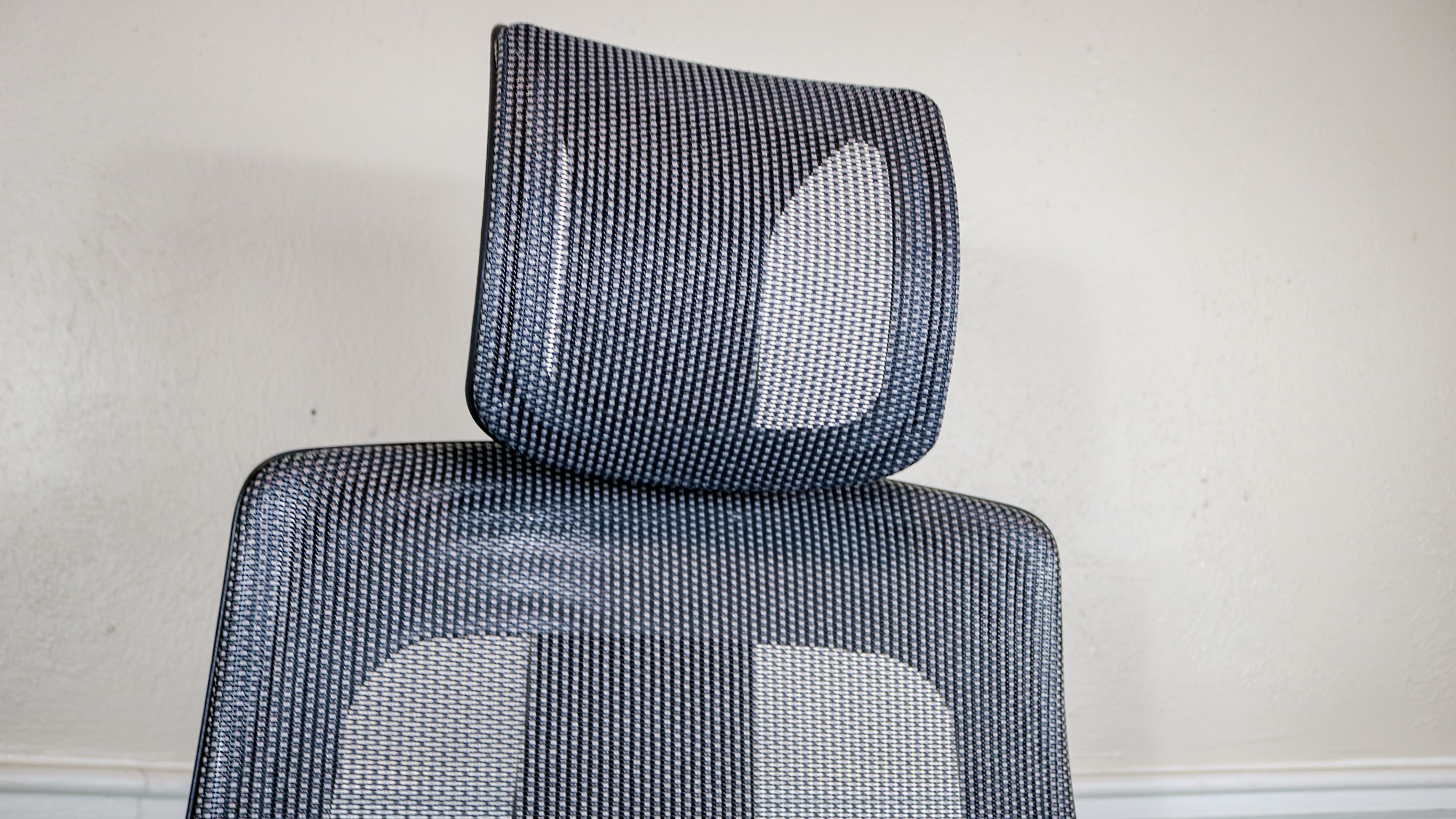 A close up shot of the Uplift Pursuit's mesh backrest and headrest