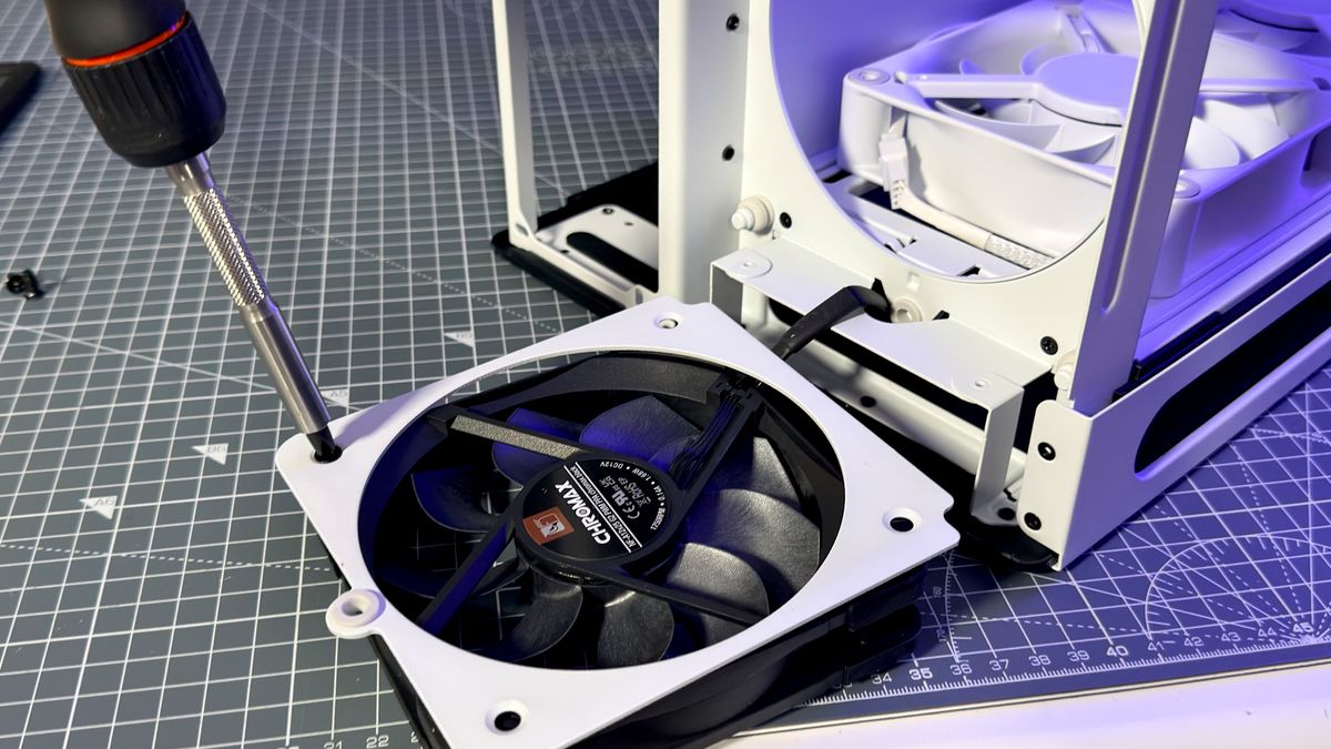 The Havn HS 360 PC case in black and white on a desk.