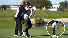 Joel Dahmen hugs his caddie whilst fist pumping after a holed putt