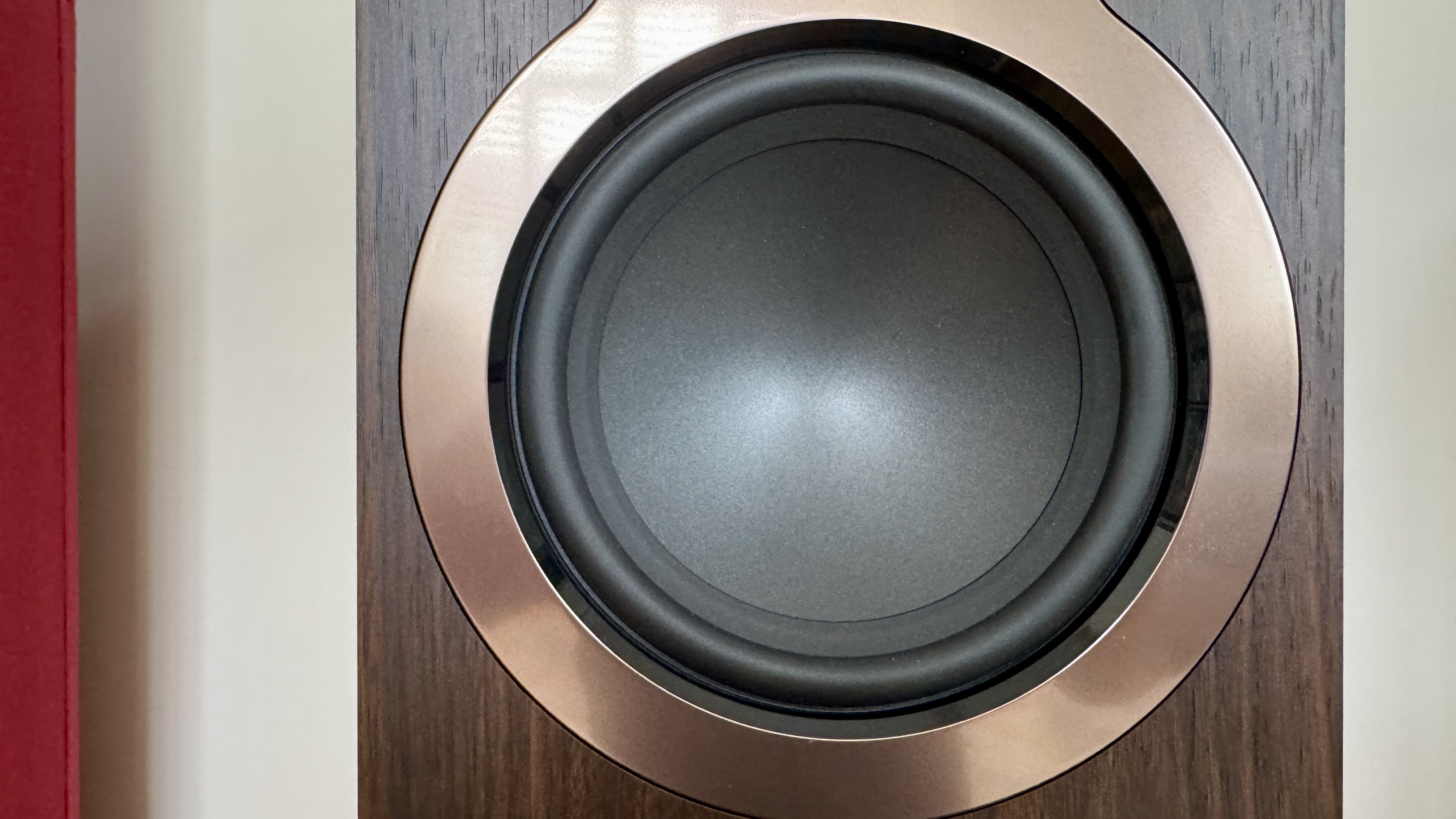 Q Acoustics 3040c speakers in a white listening room, with a hi-fi stack and turntable between them