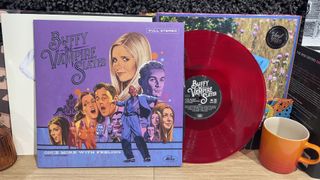 A vinyl copy of Once More With Feeling, with the red record peeping out from the sleeve.