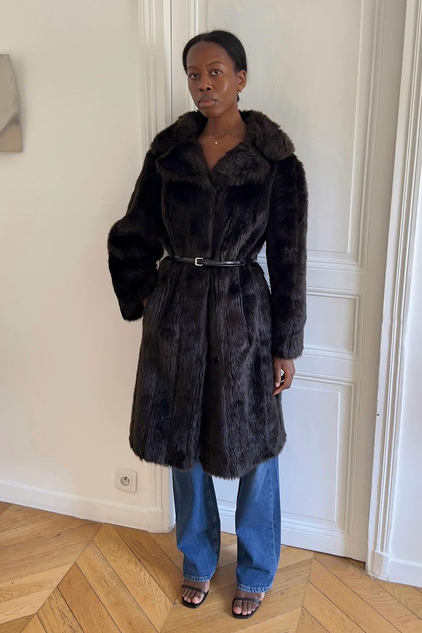 a woman wearing a fur coat