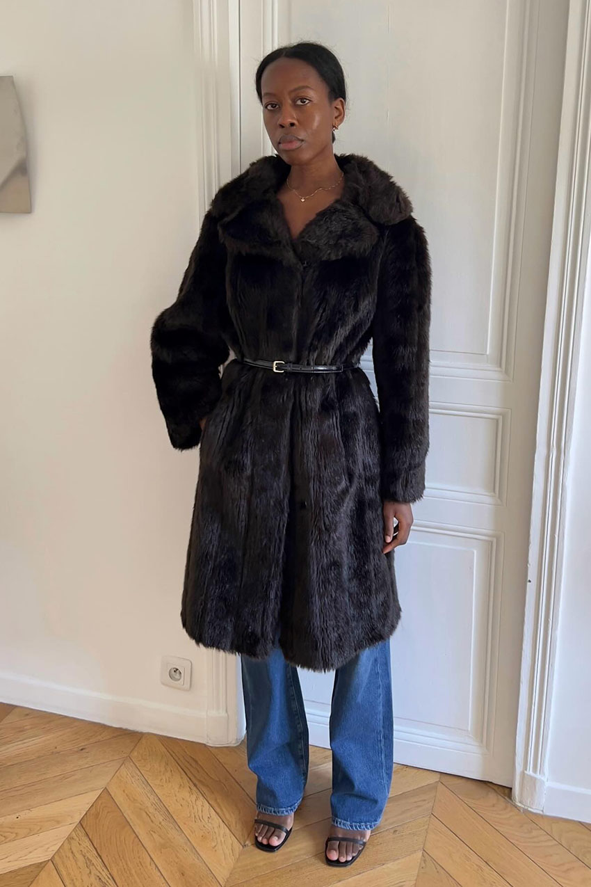 a woman wearing a fur coat