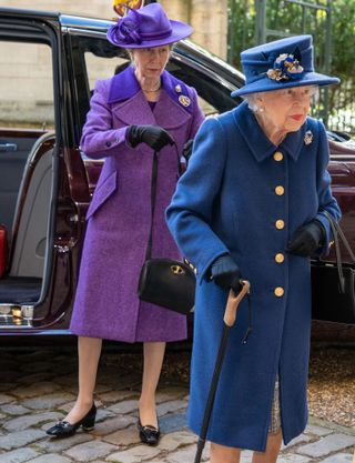 The Queen walking stick - Britain's Queen Elizabeth II (R) and Britain's Princess Anne, Princess Royal (L) arrive to attend a Service of Thanksgiving to mark the Centenary of the Royal British Legion at Westminster Abbey in London on October 12, 2021
