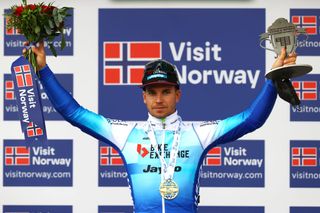 BRONNOYSUND NORWAY AUGUST 12 Dylan Groenewegen of Netherlands and Team BikeExchange Jayco celebrates at podium as stage winner during the 9th Arctic Race Of Norway 2022 Stage 2 a 1543km stage from Mosjen to Brnnysund ArcticRace on August 12 2022 in Bronnoysund Norway Photo by Michael SteeleGetty Images