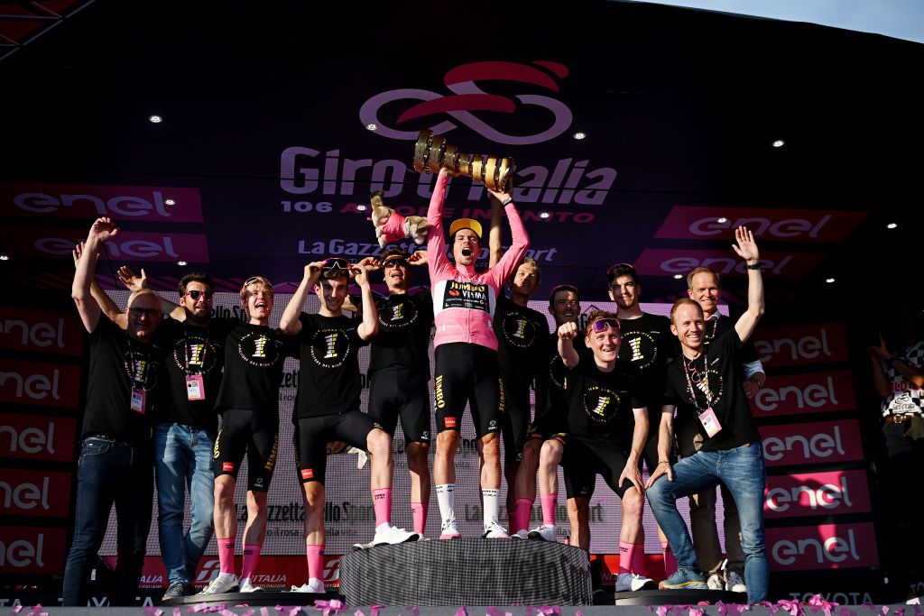 ROME ITALY MAY 28 Richard Plugge CEO JumboVisma Primo Rogli of Slovenia Pink Leader Jersey Edoardo Affini of Italy Koen Bouwman of The Netherlands Rohan Dennis of Australia Thomas Gloag of The United Kingdom Michel Hessmann of Germany Sepp Kuss of The United States Sam Oomen of The Netherlands and Team JumboVisma celebrate at podium during the 106th Giro dItalia 2023 Stage 21 a 126km stage from Rome to Rome UCIWT on May 28 2023 in Rome Italy Photo by Stuart FranklinGetty Images