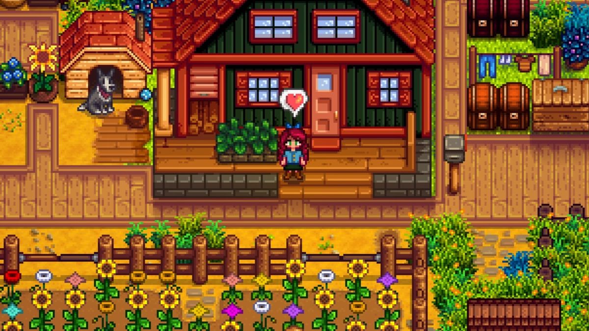 Stardew Valley player character standing outside of a green farm house with a heart over her head. Nearby, there&#039;s a black and white dog, and the farm is full of flowers and greenery. 