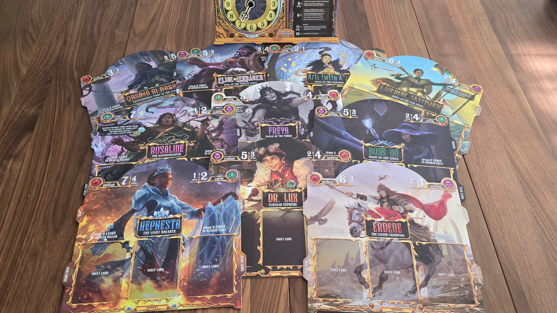 Queen by Midnight princess cards laid out on a wooden table