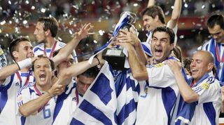 Greece players celebrate their Euro 2004 title after beating Portugal in the final.