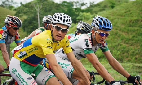 Race leader Oscar Sevilla rides next to teammate Julian Rodas.