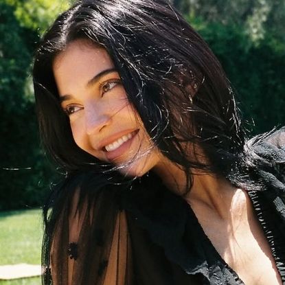 Kylie Jenner styled a matching skirt set in the leopard-print trend on her Kylie Cosmetics trip