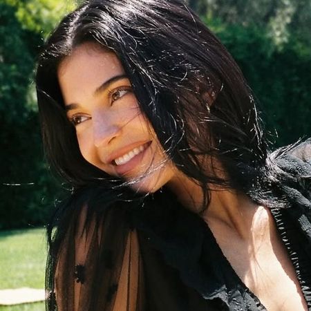 Kylie Jenner styled a matching skirt set in the leopard-print trend on her Kylie Cosmetics trip