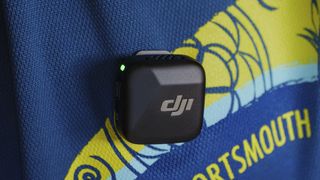 DJI Mic Mini transmitter attached to clothing