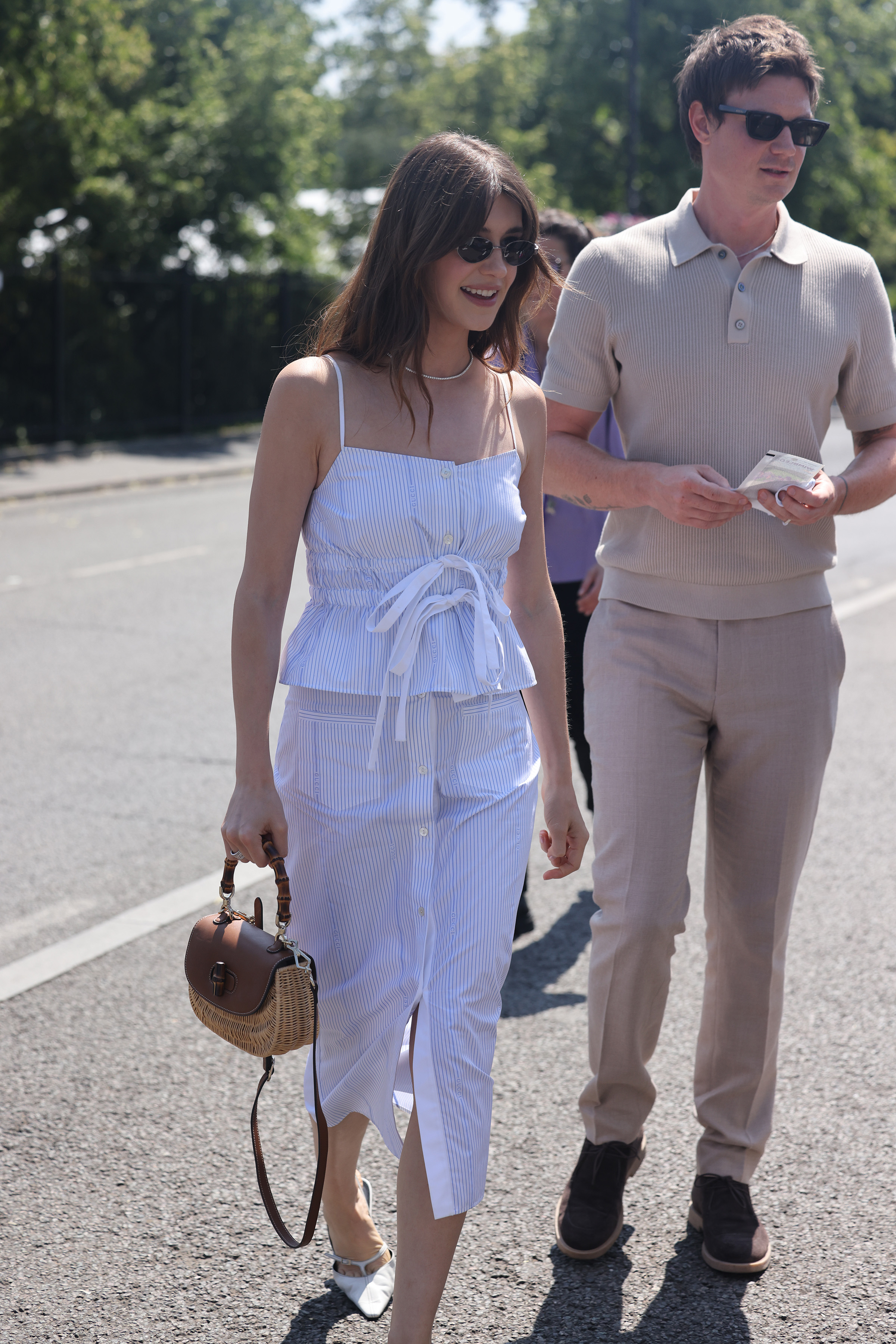 Daisy Edgar Jones wears a pinstripe co-ord with sunglasses at Wimbledon.