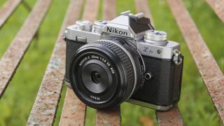 The Nikon Z fc camera with retro Z 28mm f/2.8 SE full-frame lens attached