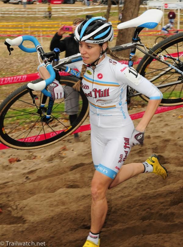 Mo Bruno-Roy (Bob's Red Mill-Seven) shoulders her bike through the sand