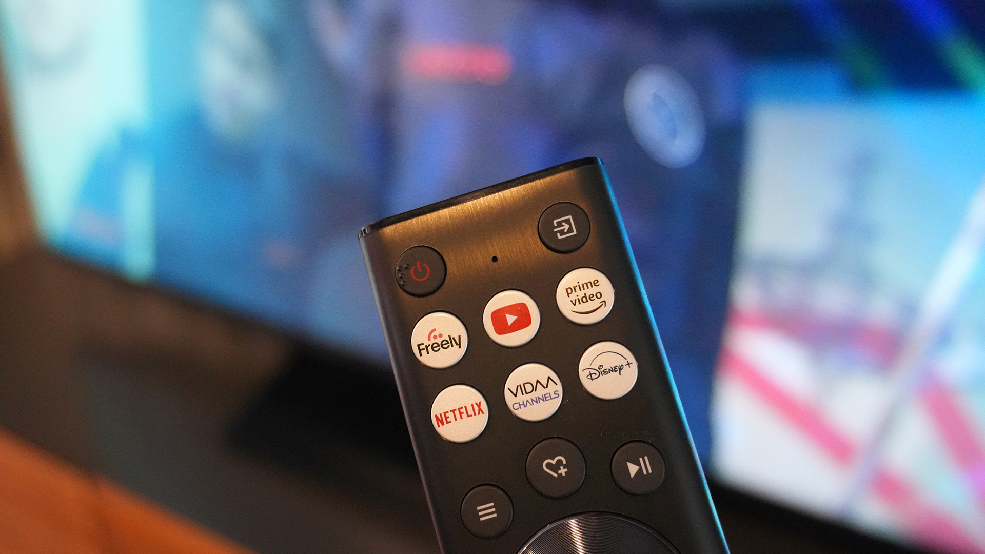 A close up of the new Hisense 2024 4K U7 TV's remote with a dedicated Freely button