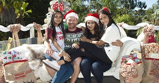 The Sharma-Rebecchi's 'Christmas in July' photoshoot for their Face of Lassiters poster in Neighbours.