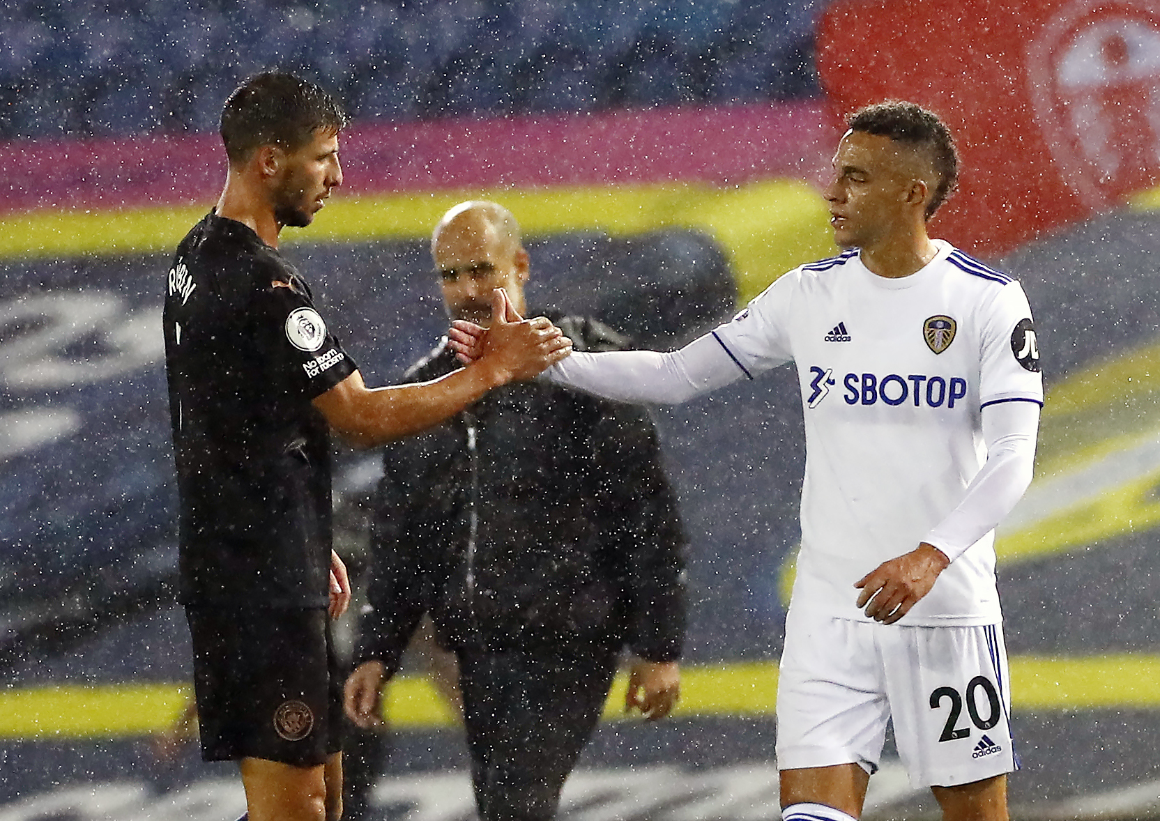 New Manchester City defender Ruben Dias, left, and Leeds forward Rodrigo