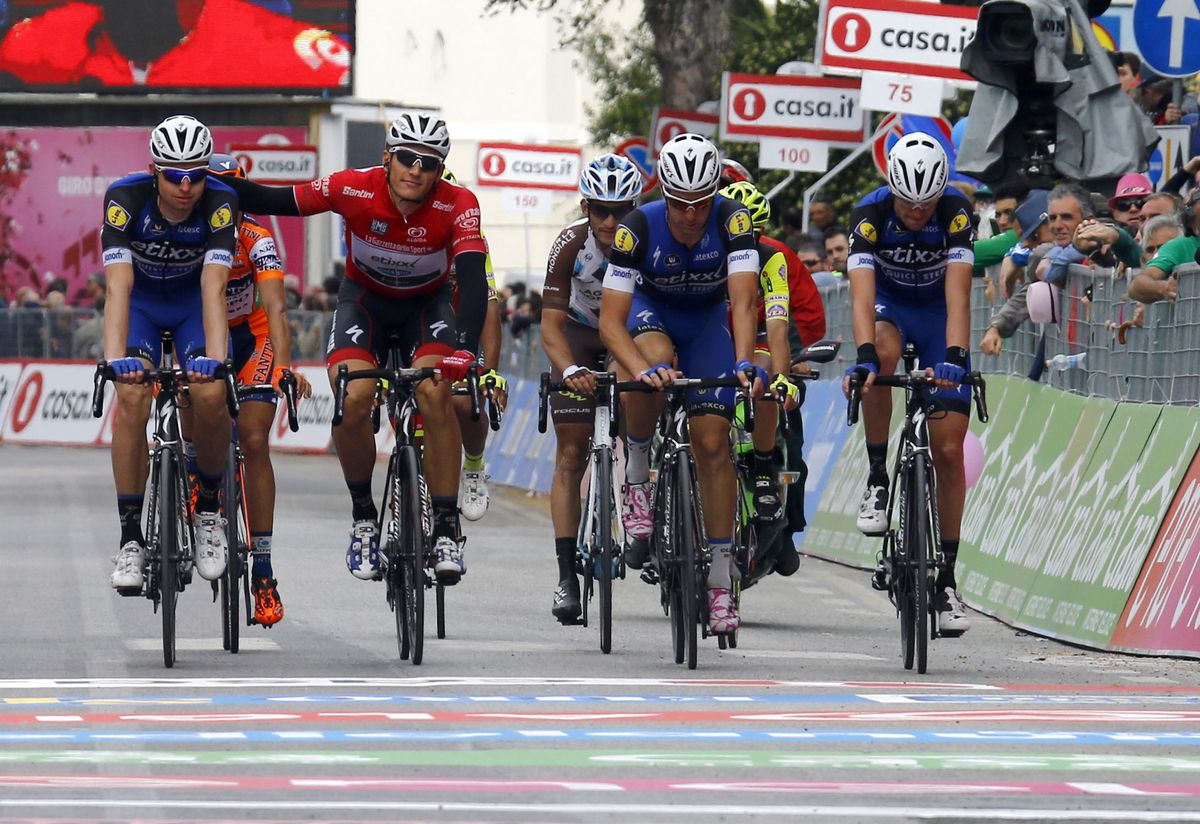 Marcel Kittel crosses the line after puncturing 5km out