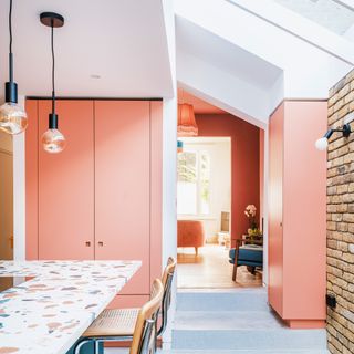 colourful kitchen with terrazzo island countertop, breakfast bar, skylight