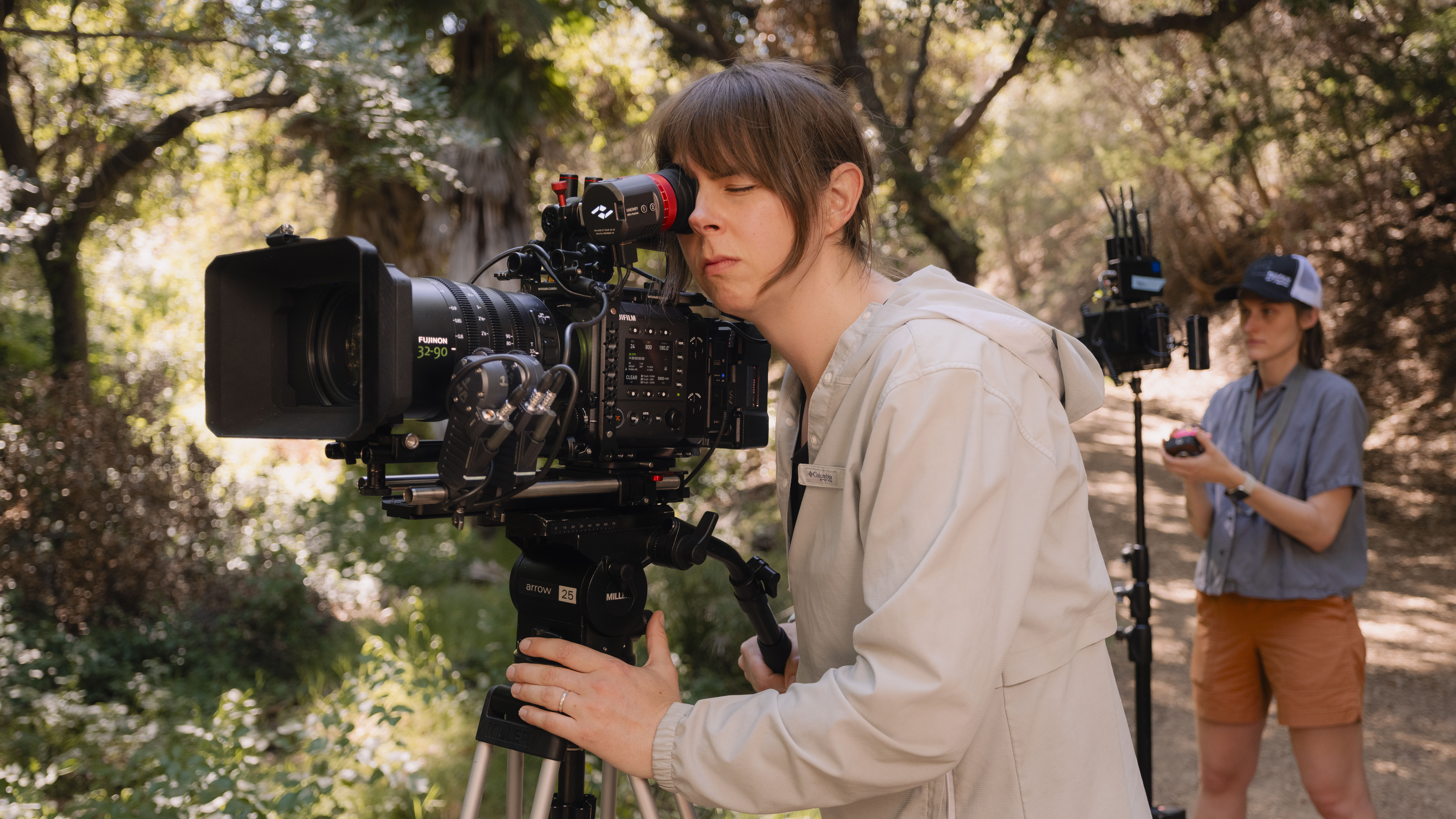 Fujifilm GFX Eterna 55 cinema camera on a tripod being operated by a videographer