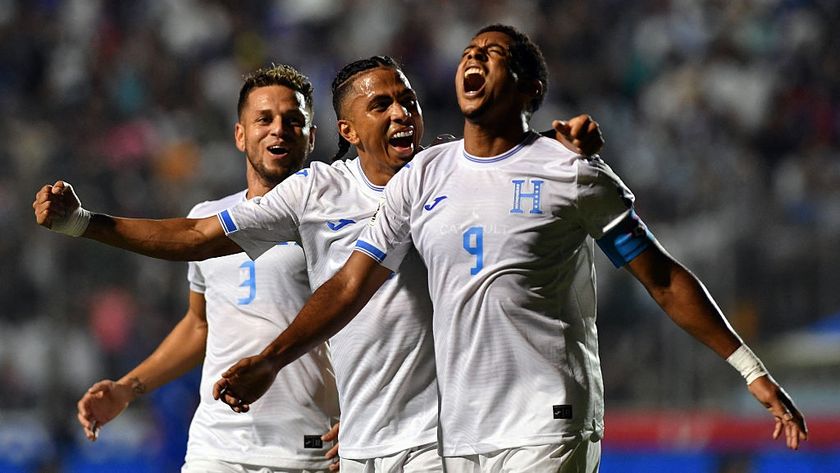 Honduras&#039; forward #09 Anthony Lozano (R) celebrates with teammates midfielder #06 Rigoberto Rivas (C) and defender #03 Raul Marcelo Santos after scoring his team&#039;s second goal during the 2026 FIFA World Cup Concacaf qualifier football match between Honduras and Haiti at the Chelato Ucles National Stadium in Tegucigalpa on October 13, 2025.