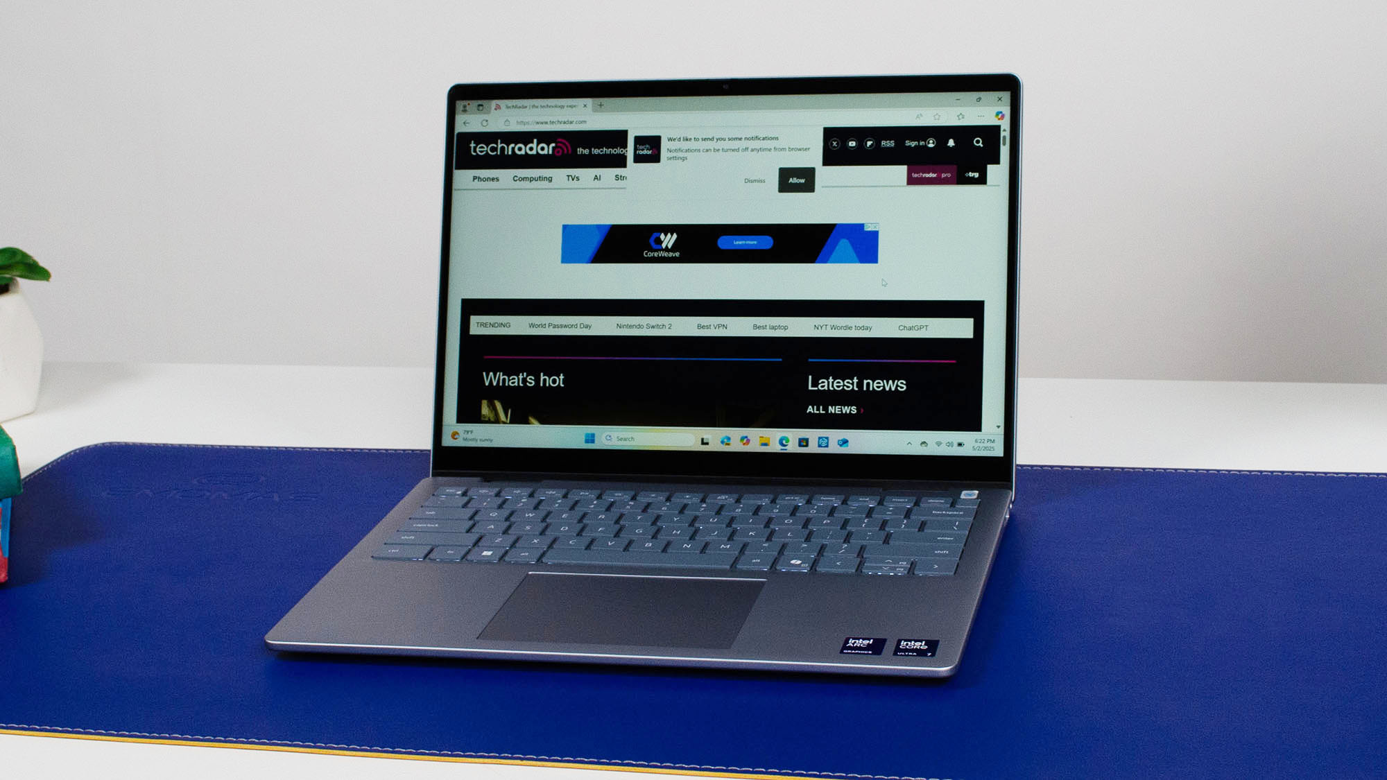 A Dell 14 Plus 2-in-1 in clamshell mode visiting TechRadar.com