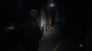 Leon exploring Toluca Prison in the Silent Hill 2 remake