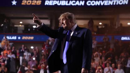 President Donald Trump points toward the crowd after speaking during the Republican National Midterm Convention at the American Airlines Center in Dallas.