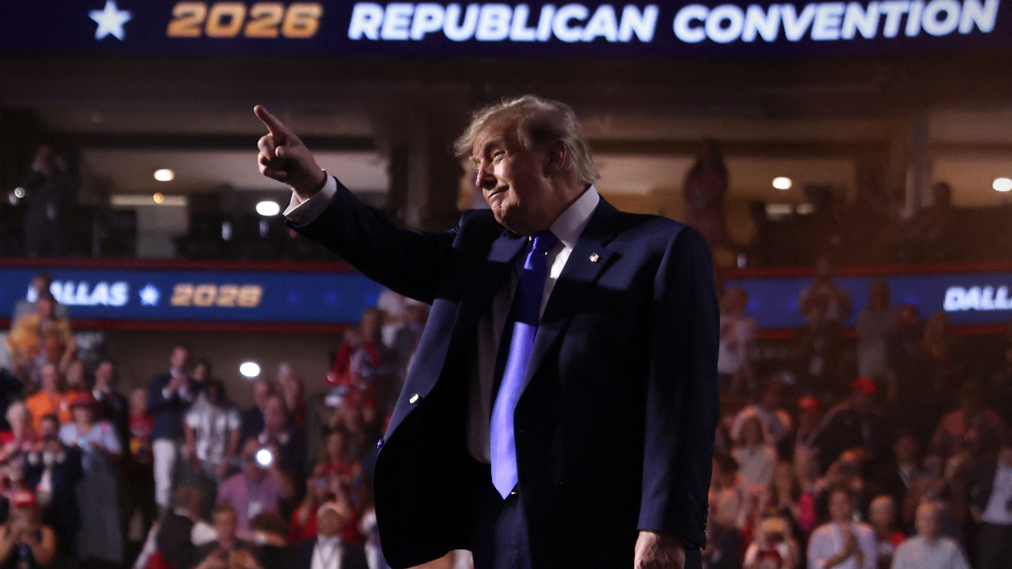 President Donald Trump points toward the crowd after speaking during the Republican National Midterm Convention at the American Airlines Center in Dallas.