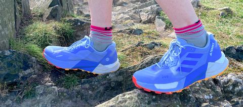 Woman wearing Adidas Terrex Agravic Ultra trail running shoes