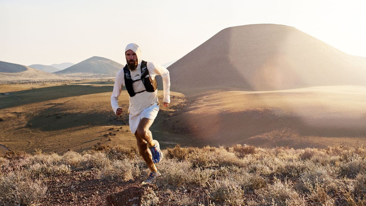 Trail runners wearing The North Face Lightrange outfit as they run on the hills