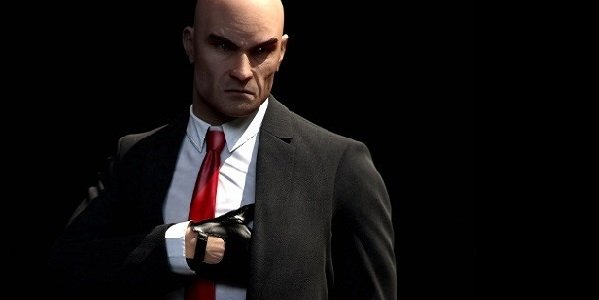 Agent 47 reaches for his gun in Hitman