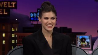 Alexandra Daddario smiling while on The Late Late Show.