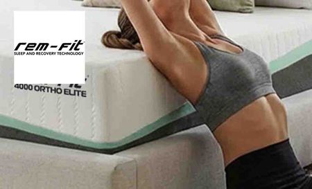 rem fit logo top left with a woman stretching onto a mattress