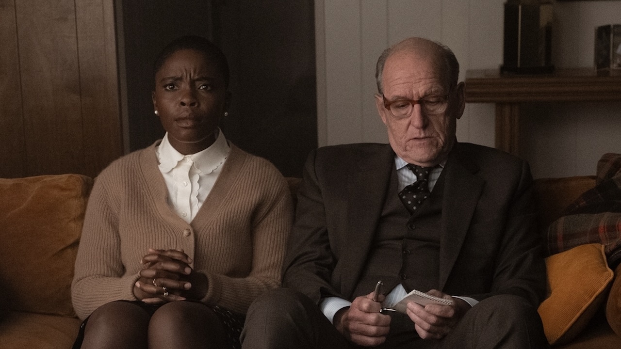 Detectives Jodie and Homer sitting on Carol's couch questioning her in DTF St. Louis Episode 6