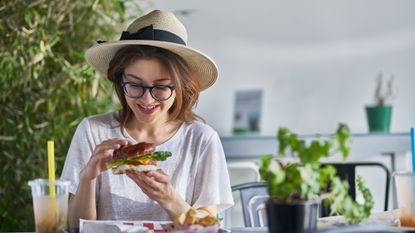 Woman eating a meat-free vegan burger