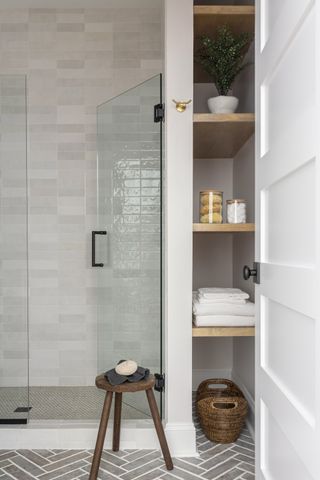 A bathroom with vertical storage
