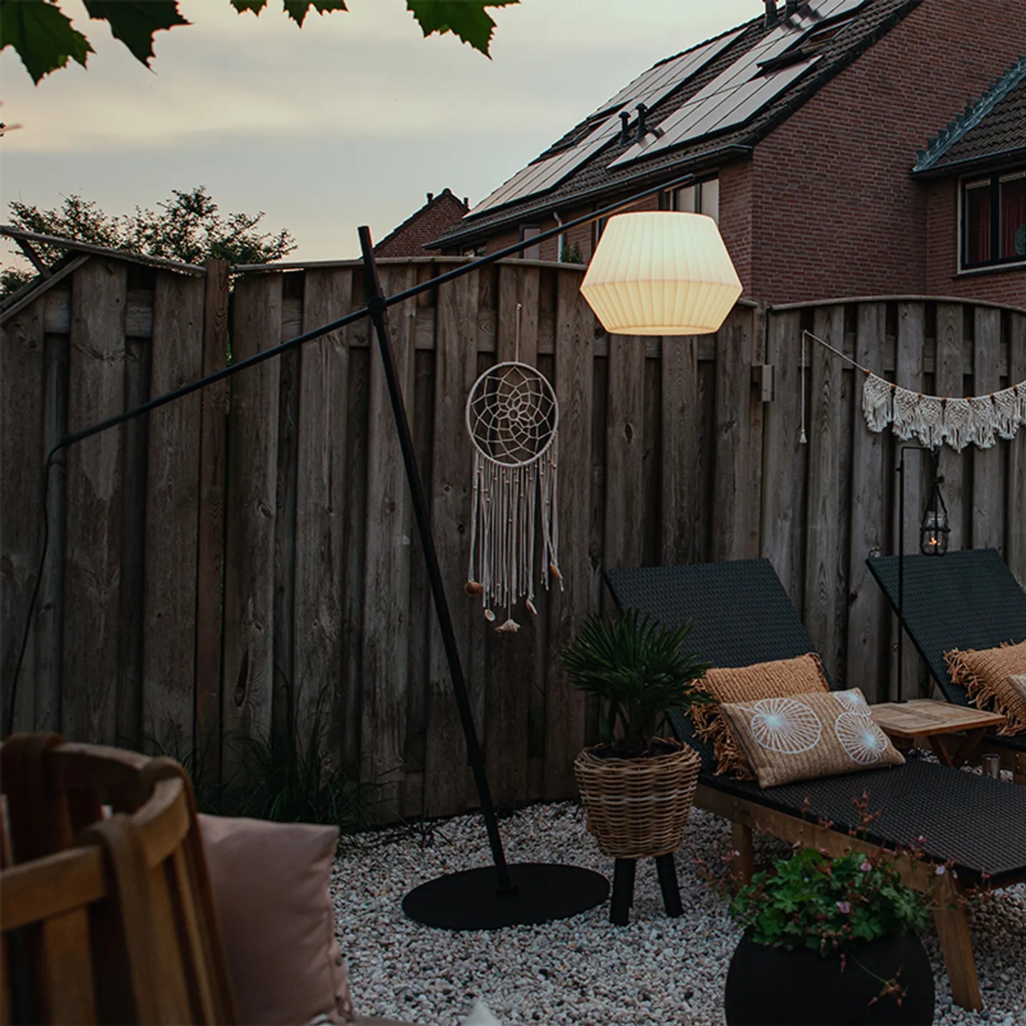 Lampandlight.co.uk's Robbert Design Outdoor Floor Lamp in a garden