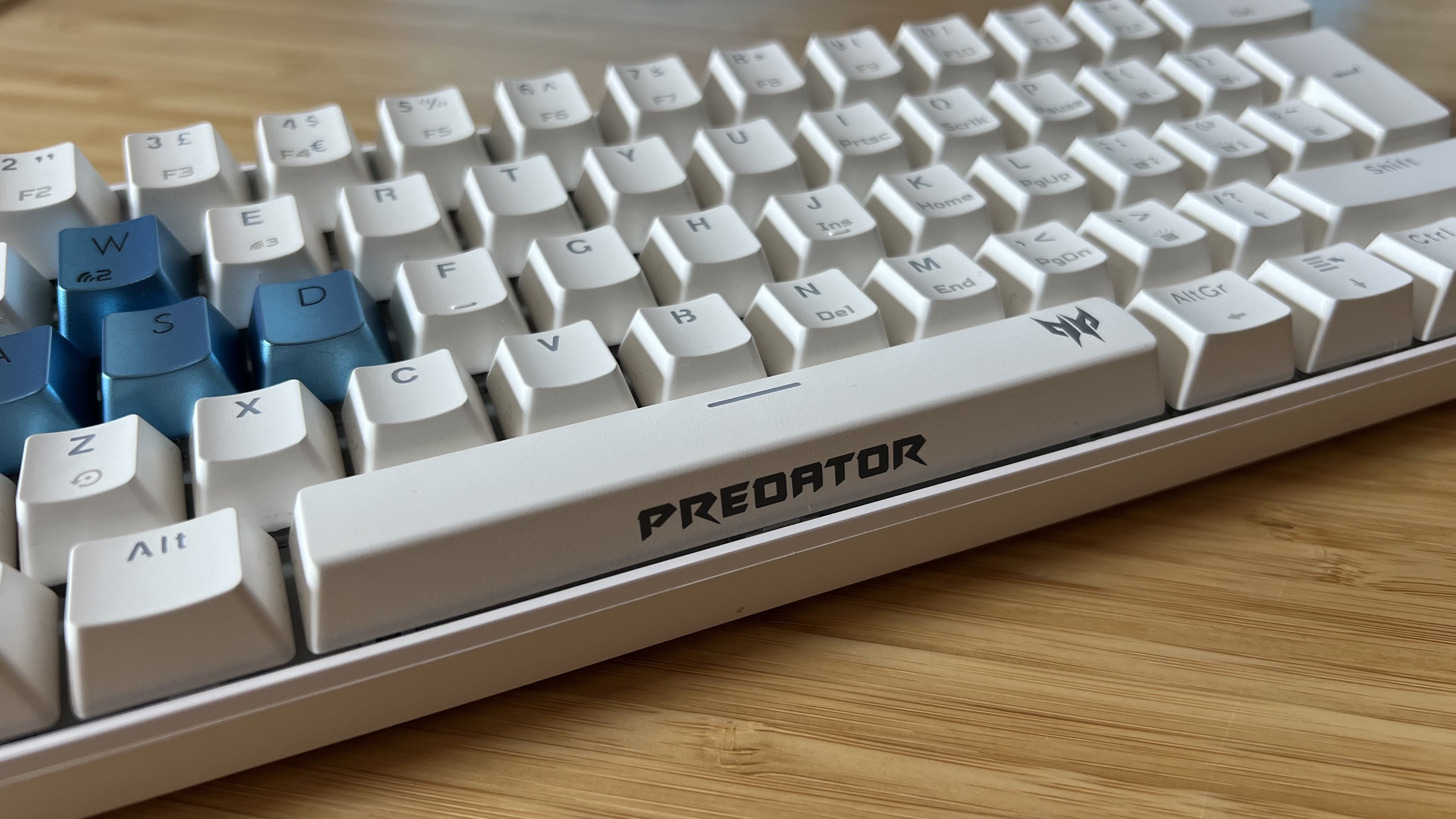 Close up on Predator logo on keycap of Acer Predator Aethon 330 gaming keyboard