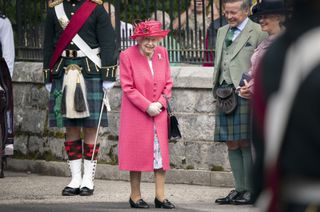 The Queen Balmoral Castle - Queen Elizabeth II during an inspection of the Balaklava Company, 5 Battalion The Royal Regiment of Scotland at the gates at Balmoral, as she takes up summer residence at the castle, on August 9, 2021 in Ballater, Aberdeenshire