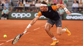 Casper Ruud of Norway plays a backhand against Holger Rune of Denmark during the Men's Singles Quarter Final match on Day Eleven of the 2023 French Open at Roland Garros